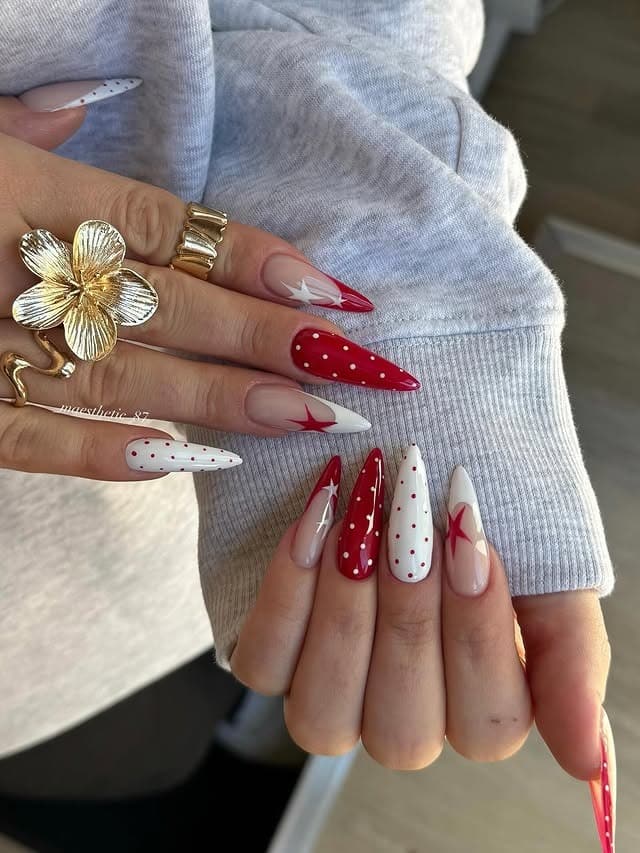 15. Red and White Star Stiletto Nails - red and white nail ideas