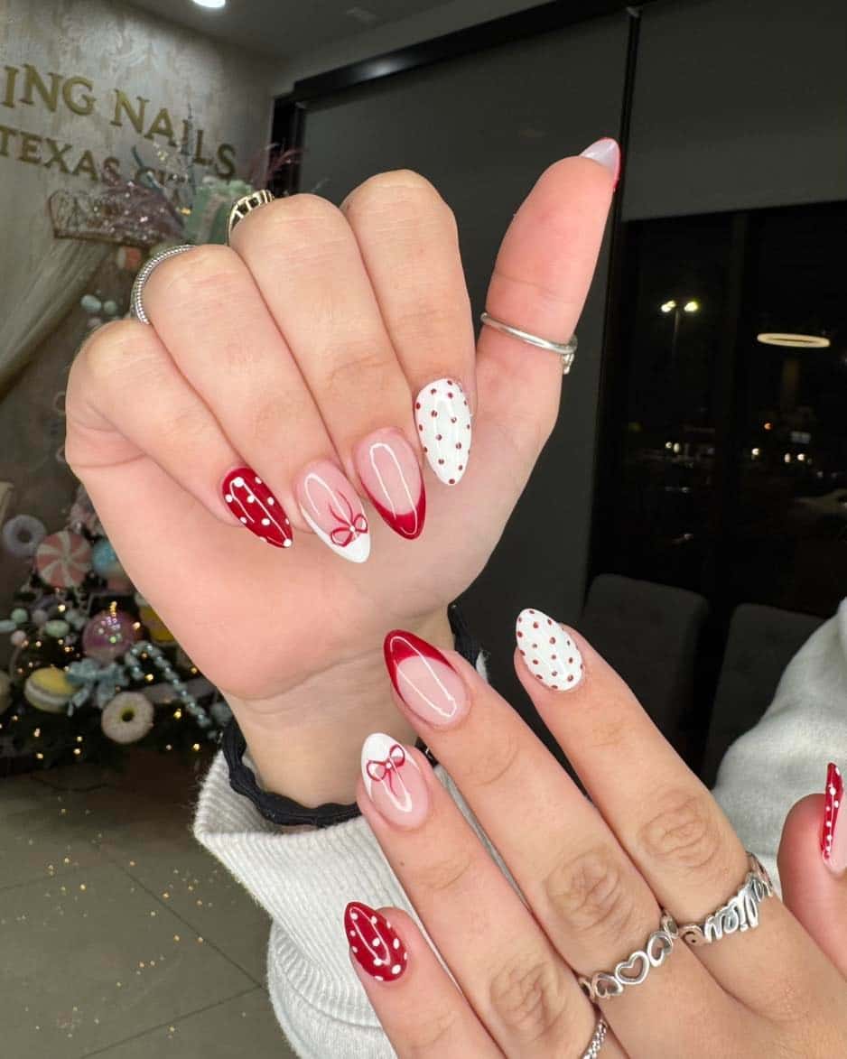 22. Red and White Bow Polka Dot Almond Nails - red and white nail ideas