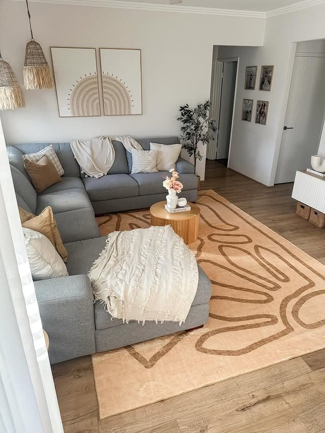 2. Cozy Gray and Beige Living Room with Abstract Rug - gray and beige living room ideas