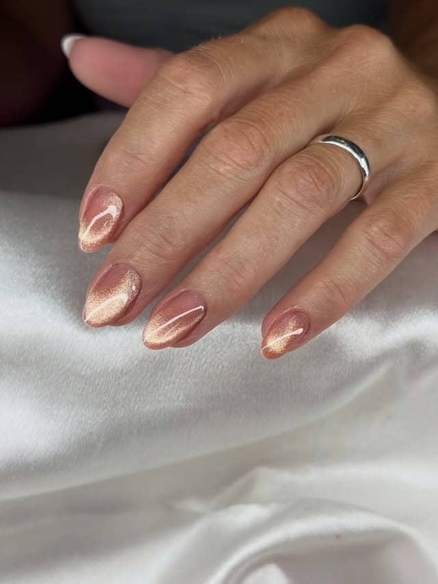 3. Rose Gold Cat-Eye Short Almond Nails - rose gold nail ideas