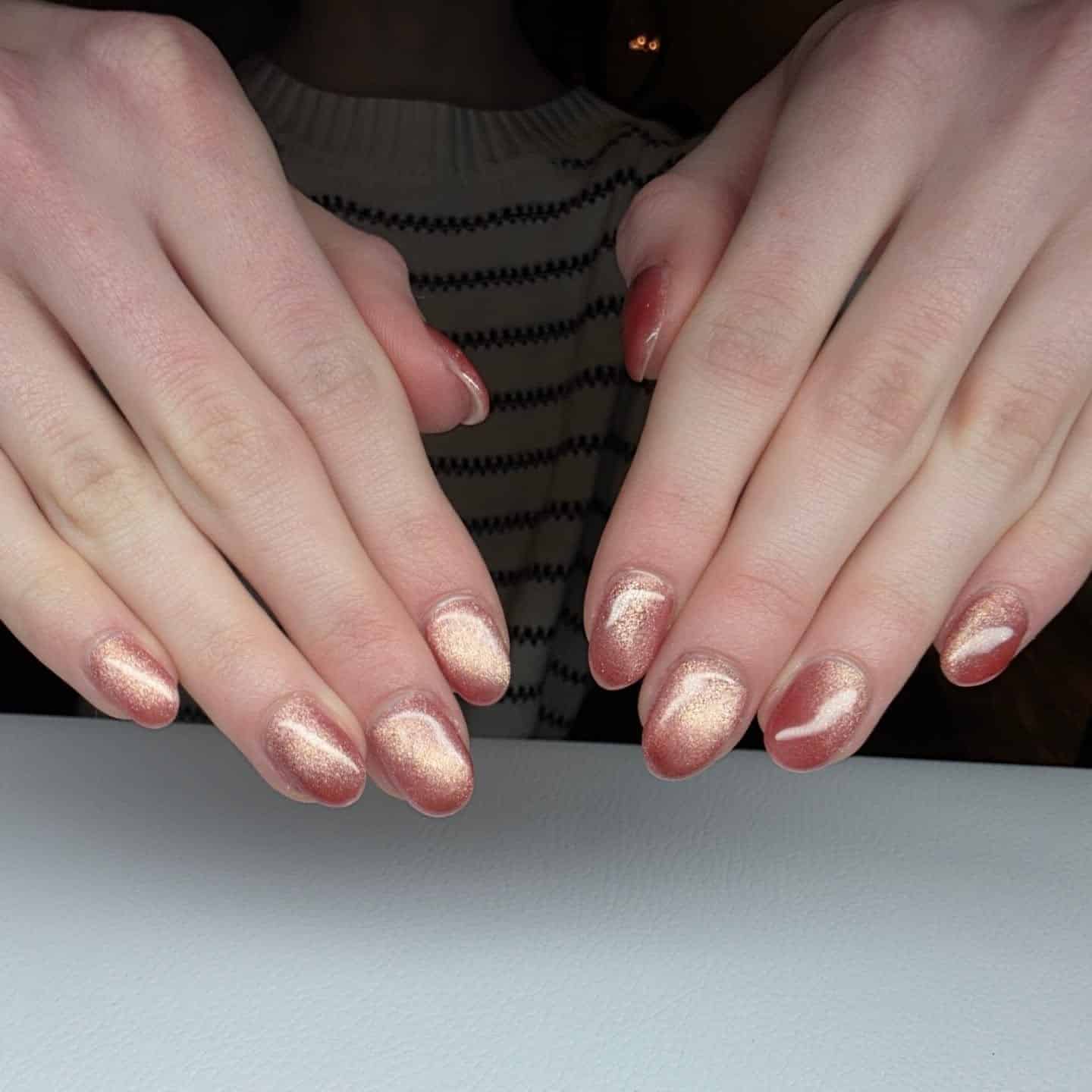 11. Rose Gold Shimmer Short Oval Nails - rose gold nail ideas