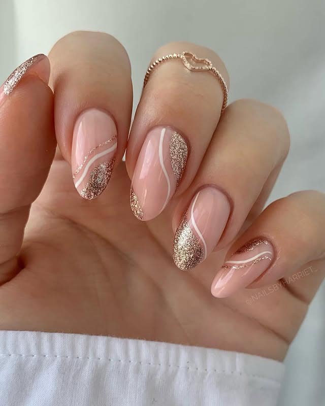 19. Blush Pink Rose Gold Glitter Swirl Almond Nails - rose gold nail ideas