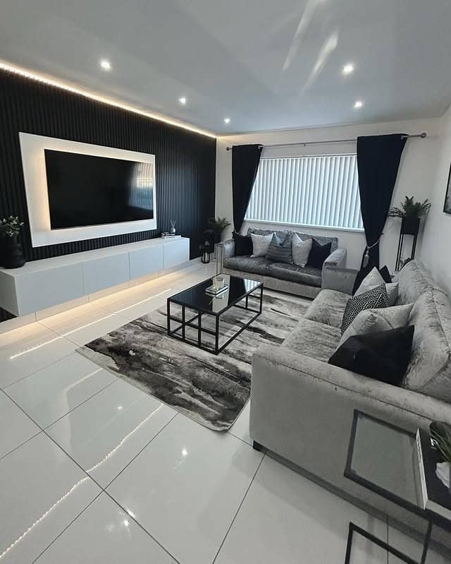 6. Black Media Wall and Grey Sofa Living Room Idea - black and grey living room ideas