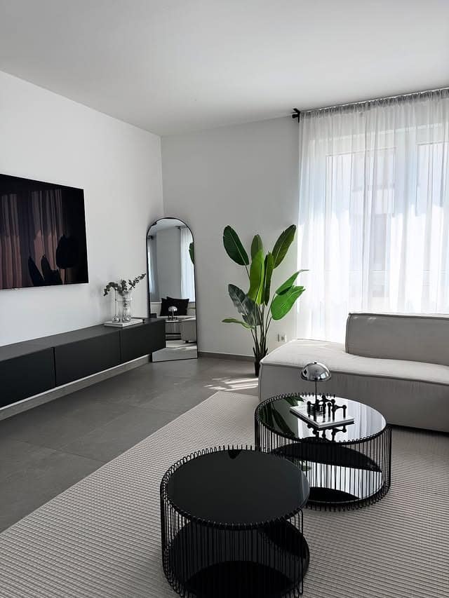 8. Minimal Black and Light Grey Living Room Idea - black and grey living room ideas