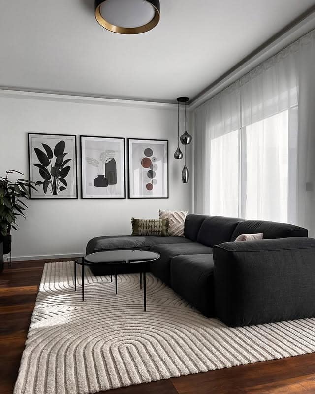 14. Charcoal Sectional and Cream Grey Living Room Idea - black and grey living room ideas