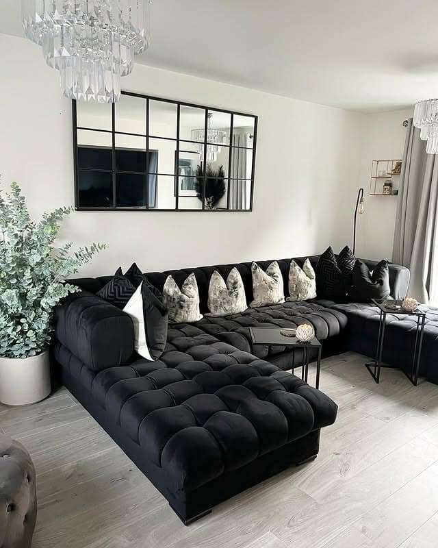 21. Black Tufted Sectional and Soft Grey Living Room Idea - black and grey living room ideas