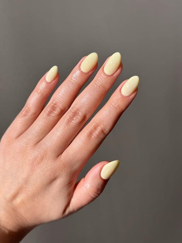 7. Creamy Butter Yellow Round Nails - round nail ideas