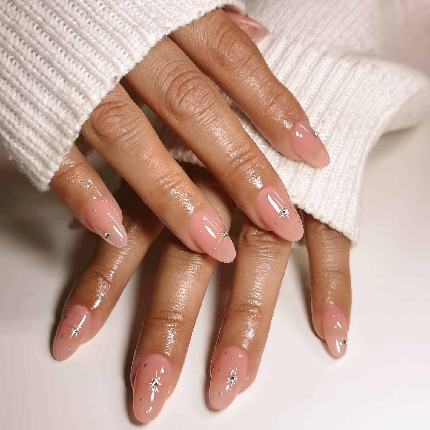 15. Nude Pink Starburst Round Nails - round nail ideas