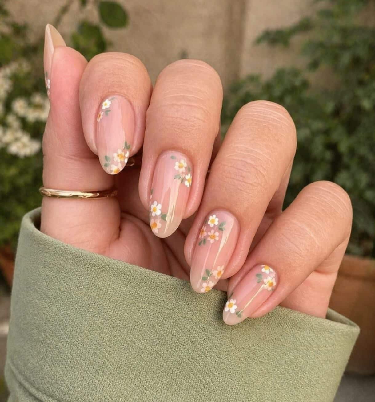 7. Nude Micro Daisy Almond Nails - simple flower nail ideas