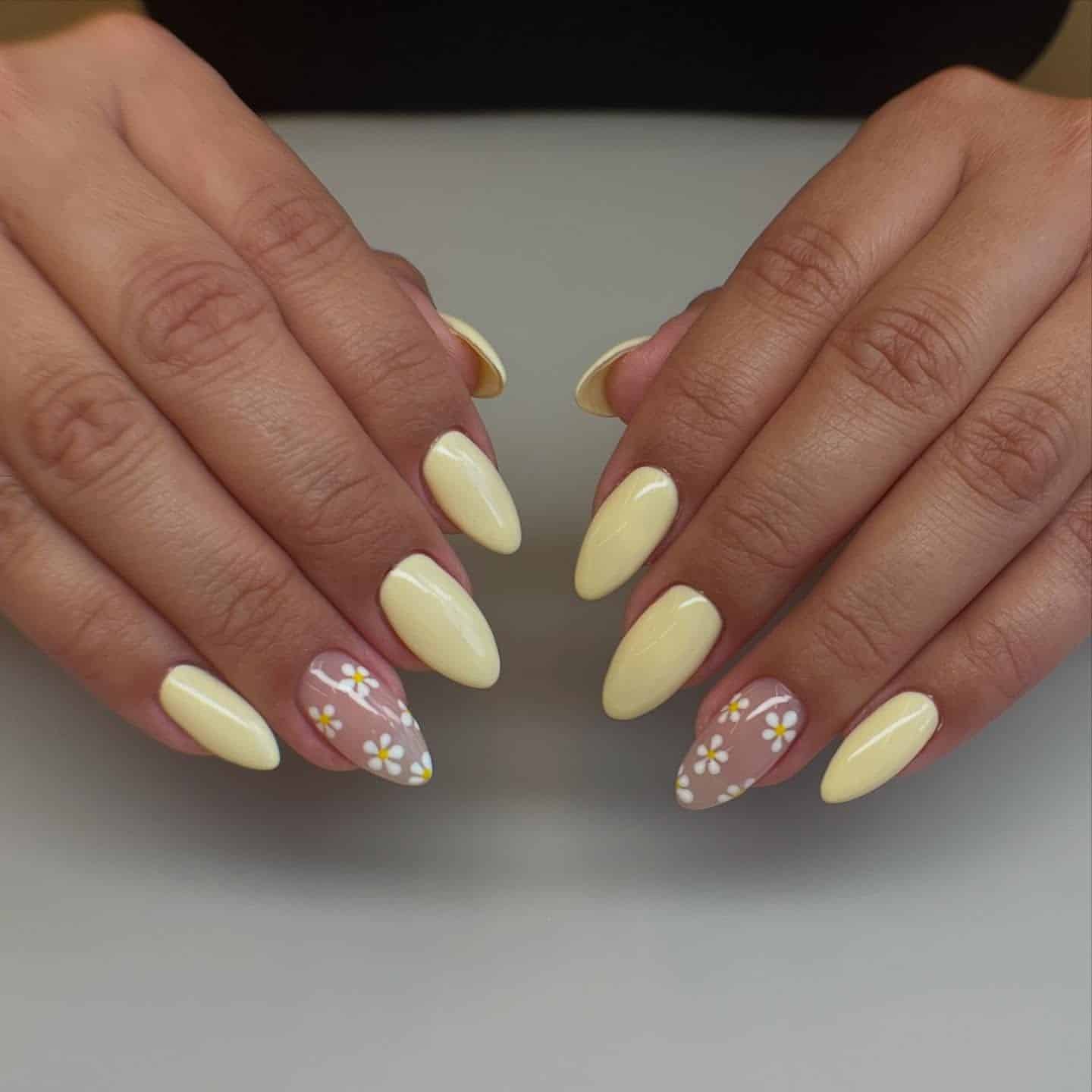 17. Butter Yellow Daisy Almond Nails - simple flower nail ideas