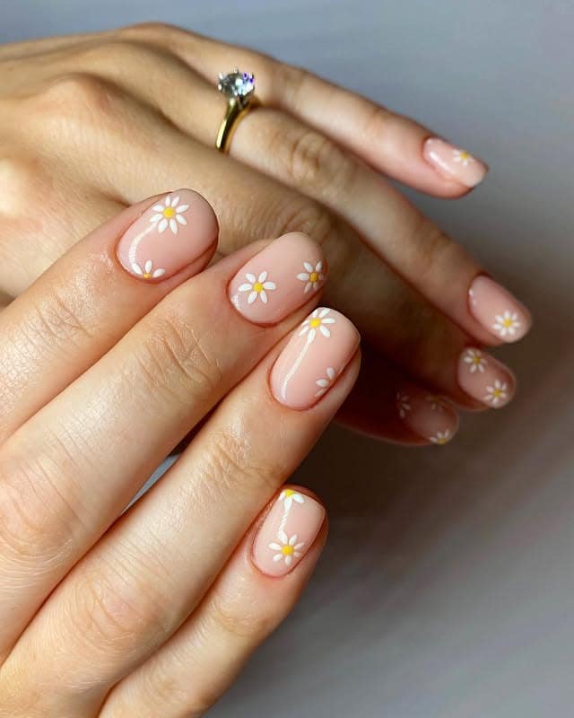 18. Sheer Nude Micro Daisy Short Nails - simple flower nail ideas