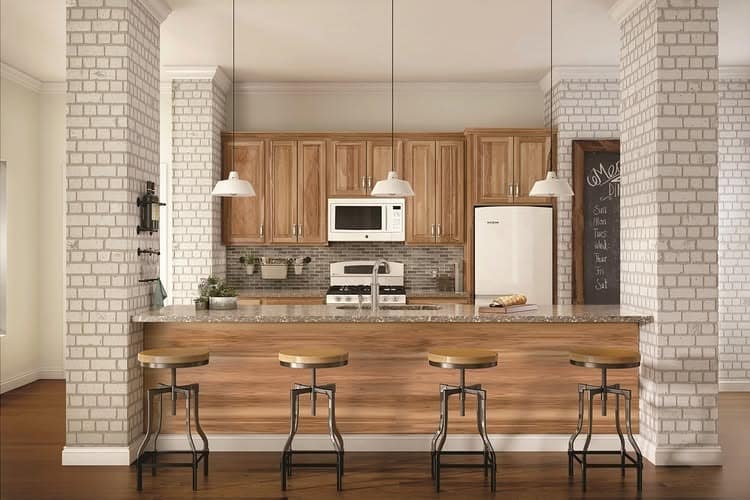 1. Warm Hickory Cabinets with White Brick - hickory kitchen cabinet ideas