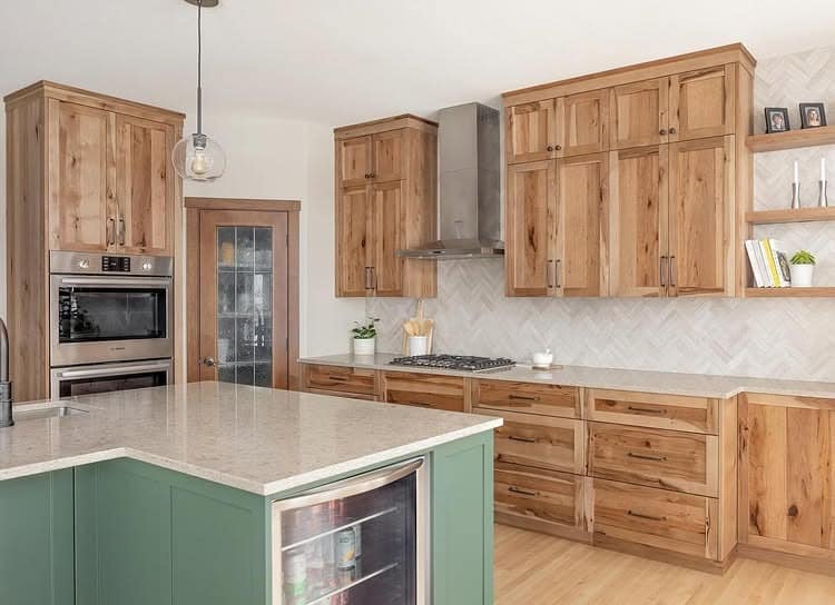 15. Warm Hickory Cabinets with Soft Green Island - hickory kitchen cabinet ideas