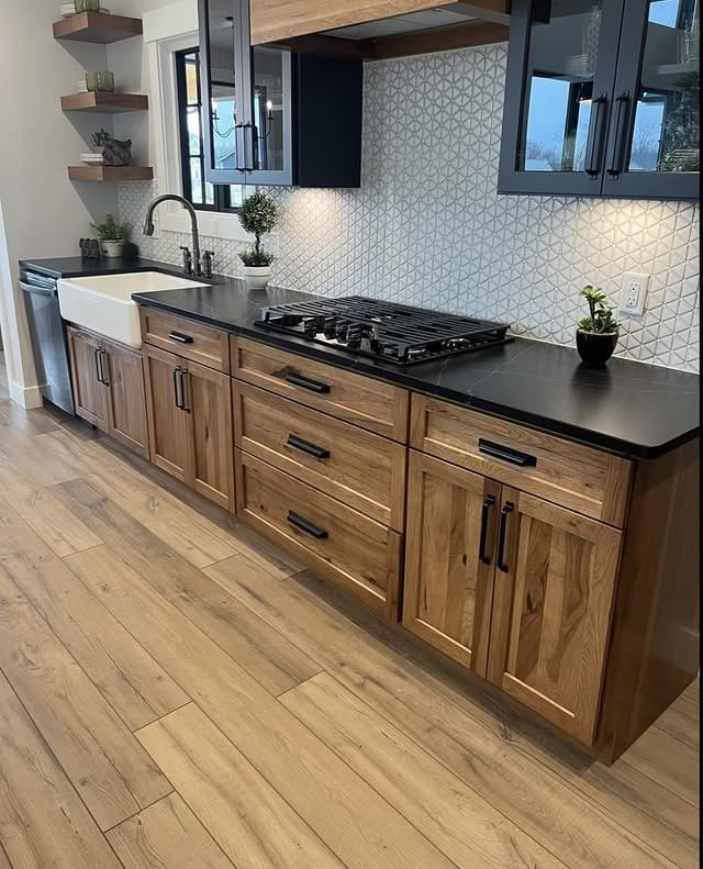 21. Warm Hickory Cabinets with Matte Black - hickory kitchen cabinet ideas