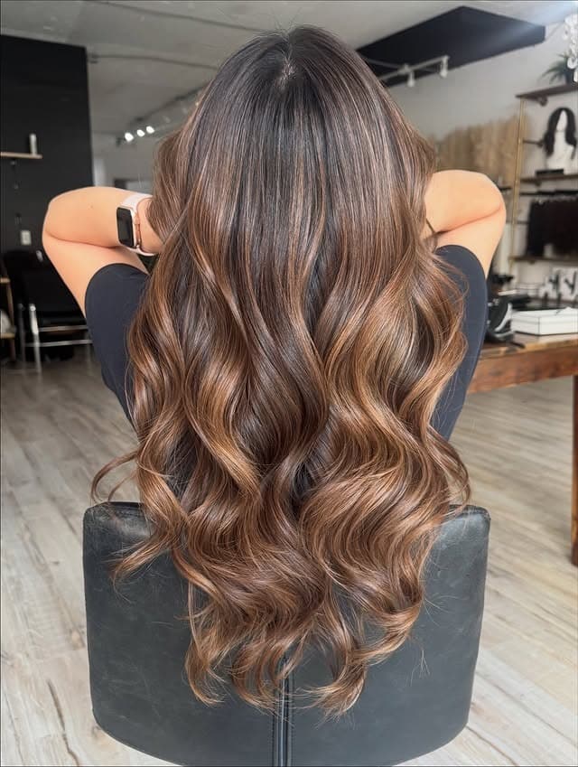 6. Cinnamon Caramel Balayage with Glossy Waves - Balayage Hair Colors