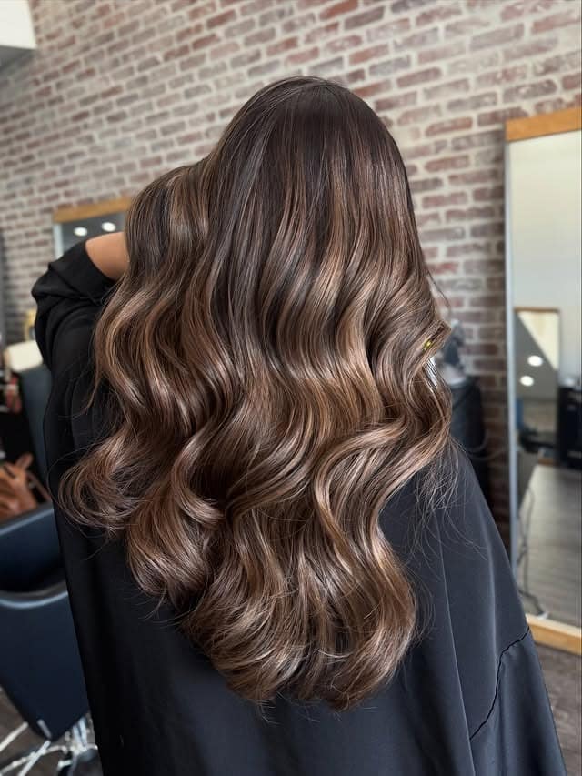 14. Chocolate Brown Balayage with Glossy Waves - Balayage Hair Colors