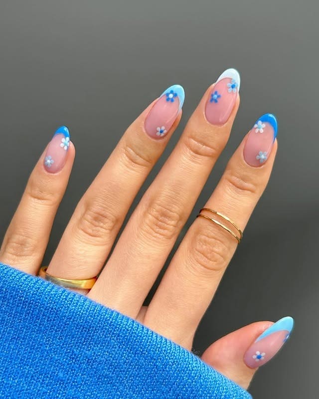 1. Baby Blue Floral French Almond Nails - baby blue nail ideas