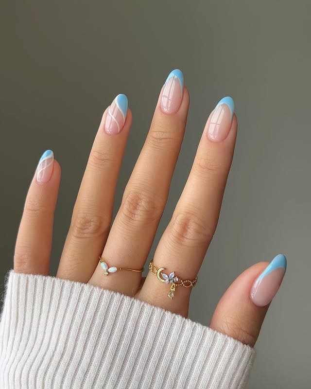 17. Baby Blue Swirl French Almond Nails - baby blue nail ideas