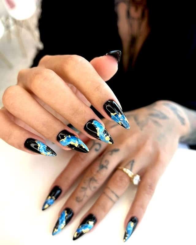 1. Black and Electric Blue Gold Foil Stiletto Nails - black and blue nail ideas