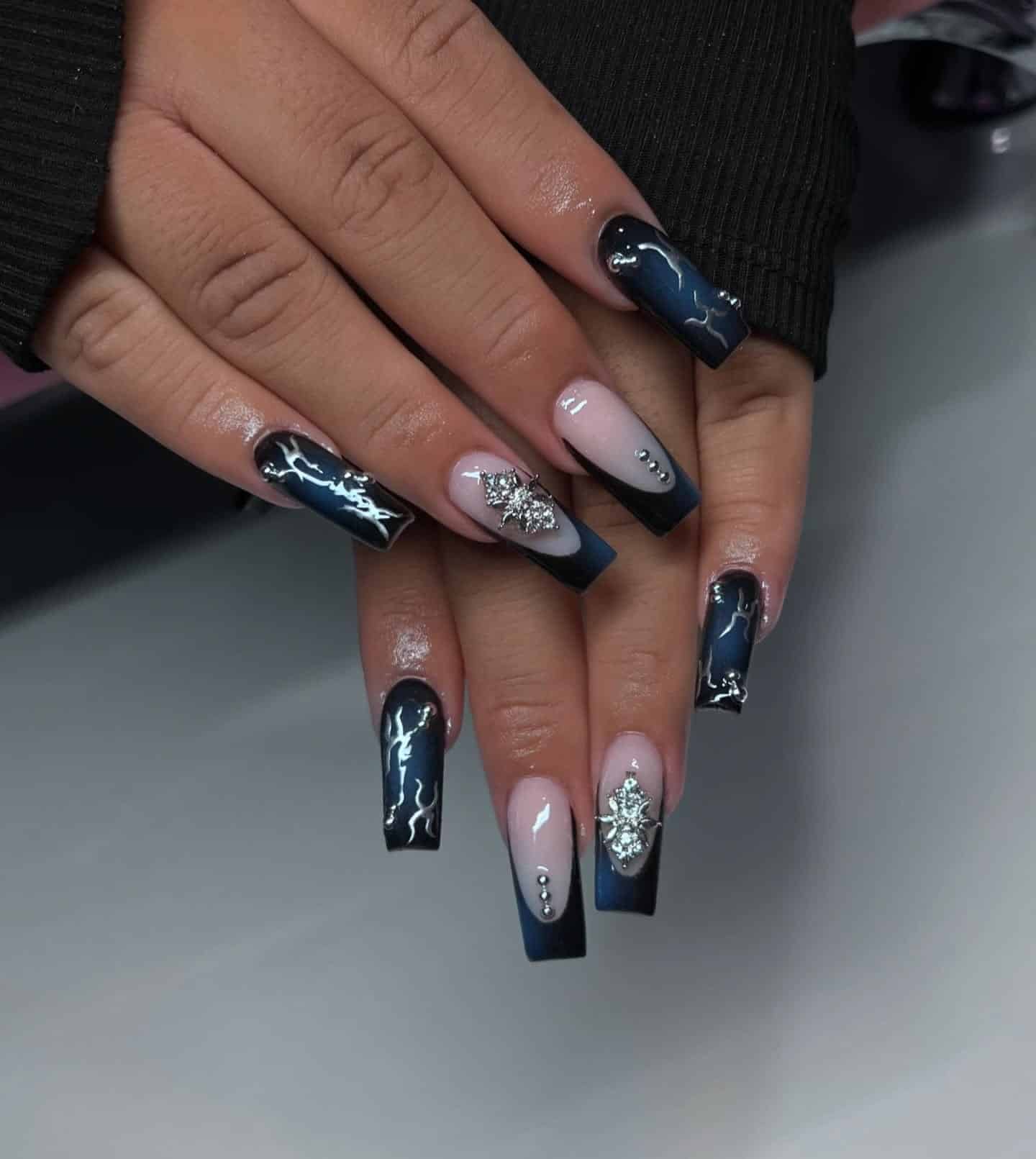2. Midnight Blue and Black Coffin Nails with Silver Charms - black and blue nail ideas