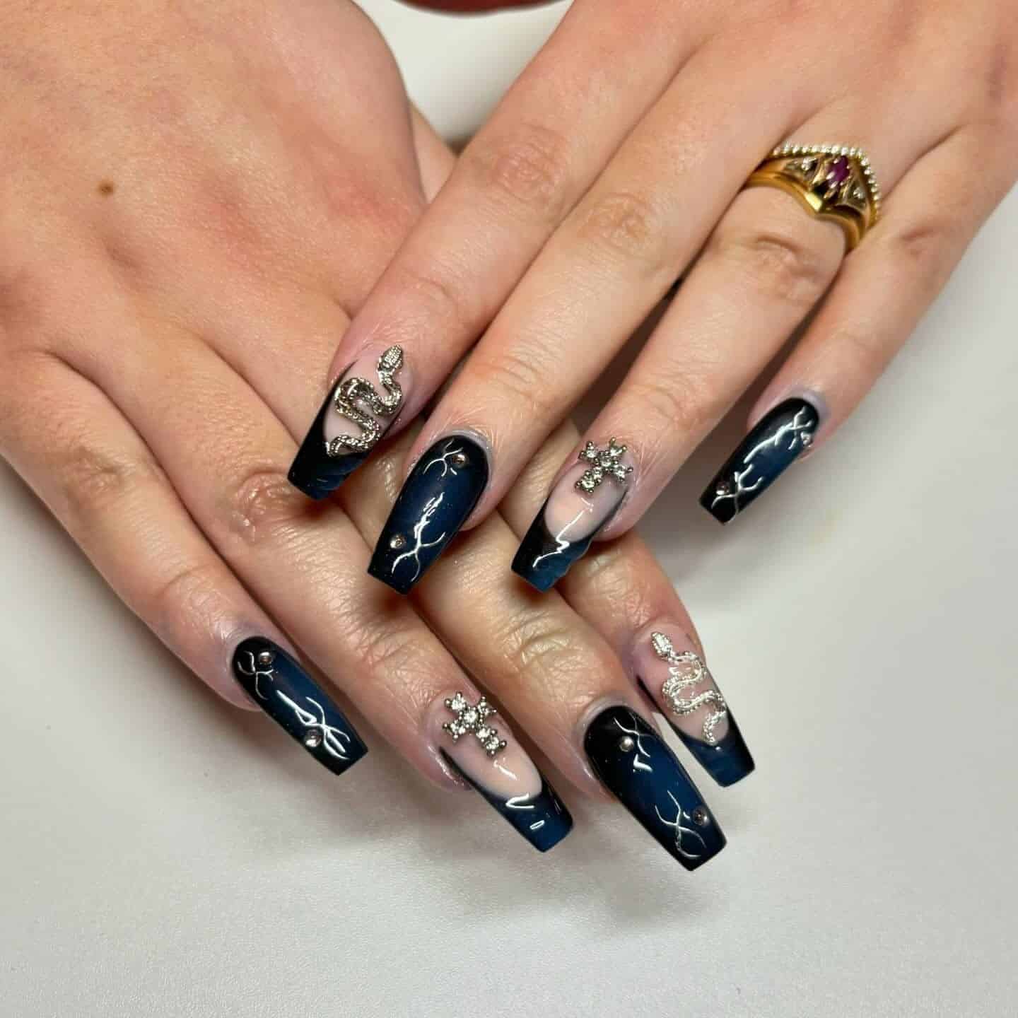 6. Midnight Blue and Black Celestial Coffin Nails - black and blue nail ideas