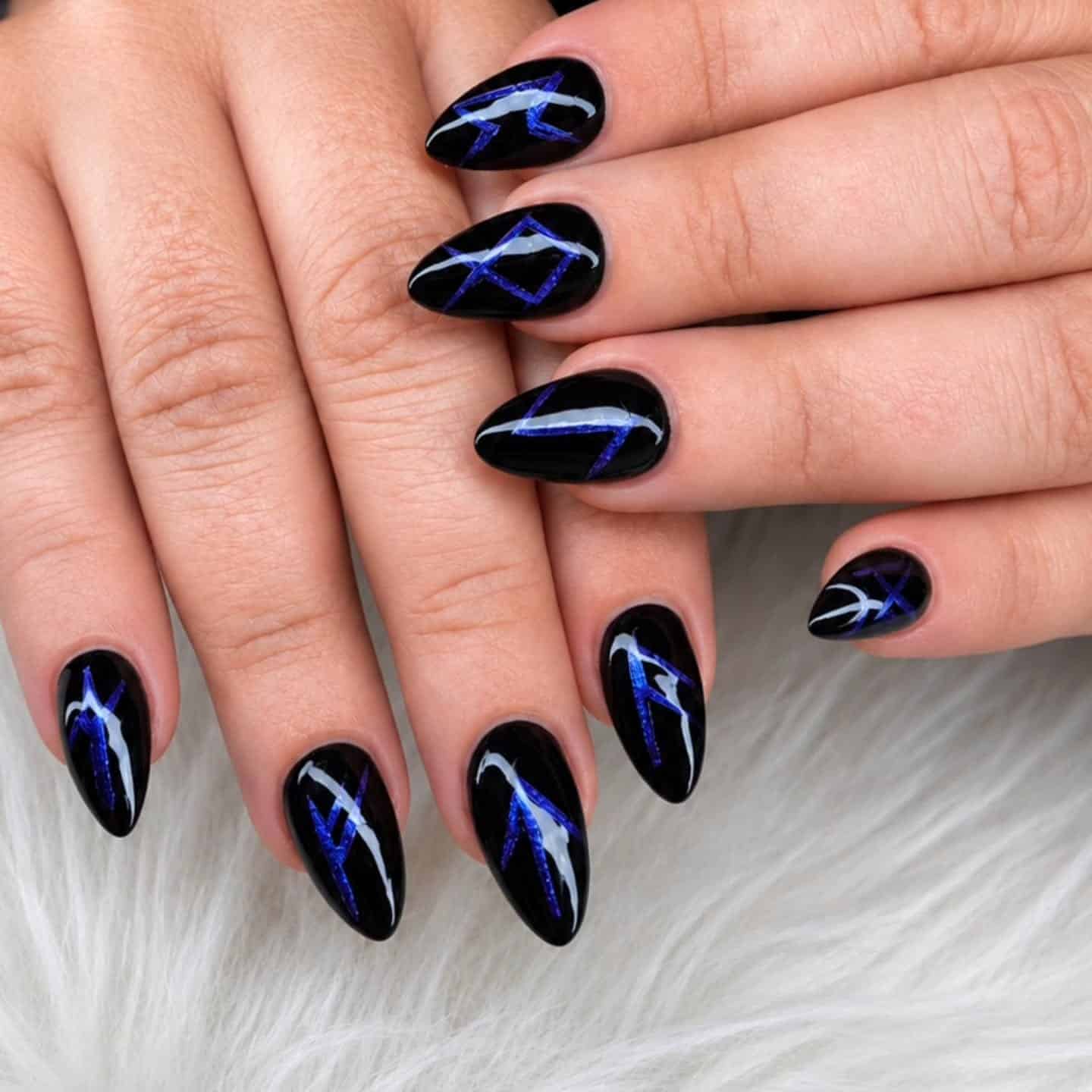 12. Black and Cobalt Blue Abstract Almond Nails - black and blue nail ideas