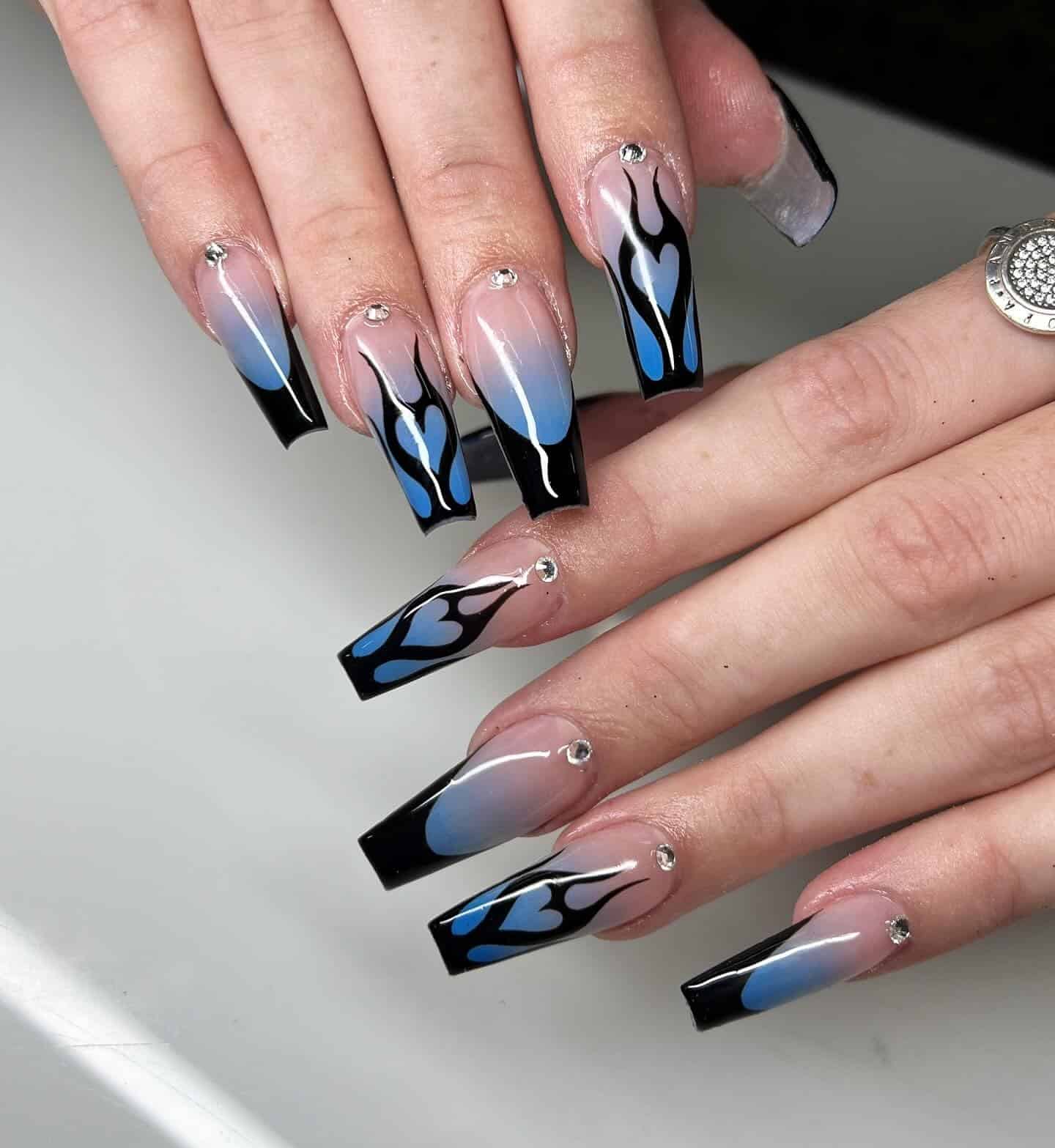 15. Black and Blue Flame Coffin Nails - black and blue nail ideas