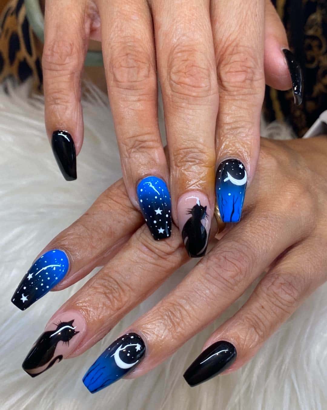 18. Black and Electric Blue Celestial Coffin Nails - black and blue nail ideas