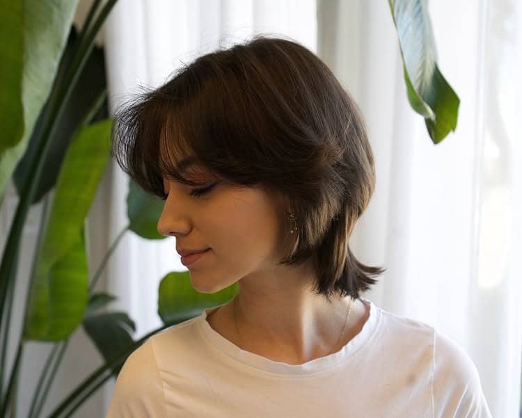 15. Deep Brunette Feathered Short Shag - Short Shag Haircuts