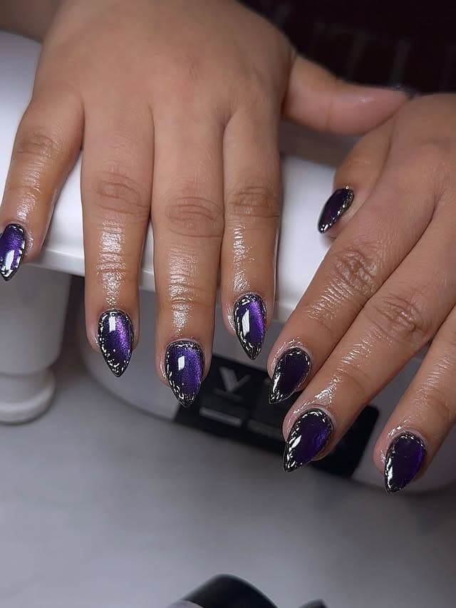 8. Metallic Purple Almond Nails with Black Edging - black and purple nail ideas