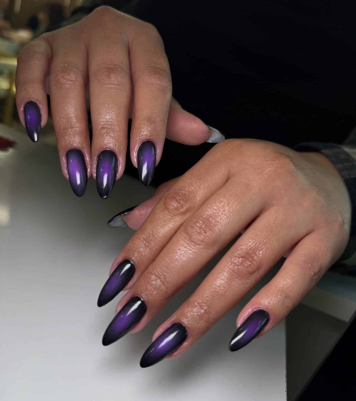 11. Black and Purple Aura Almond Nails - black and purple nail ideas