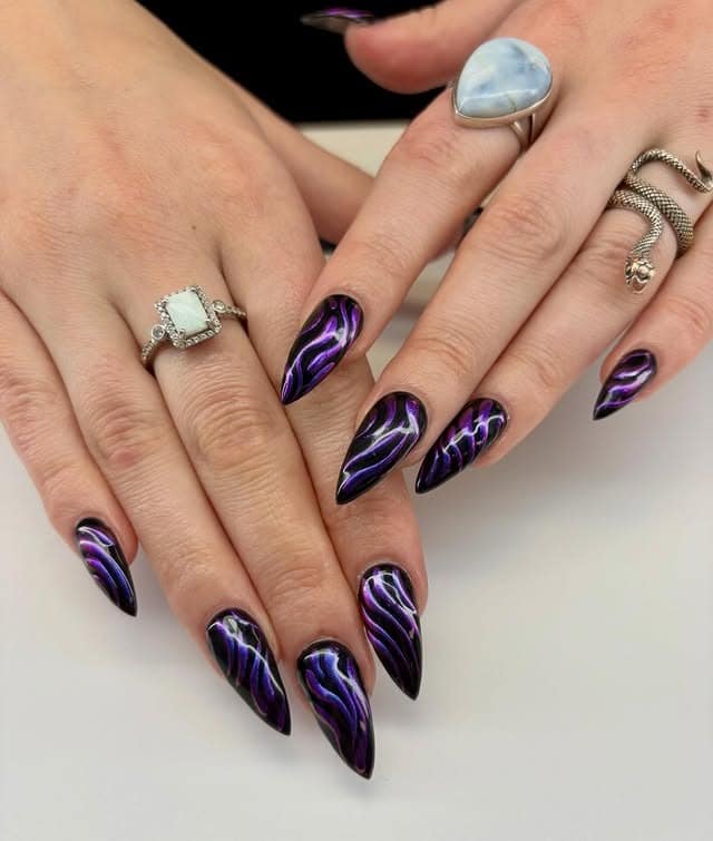 12. Black Stiletto Nails with Metallic Purple Waves - black and purple nail ideas