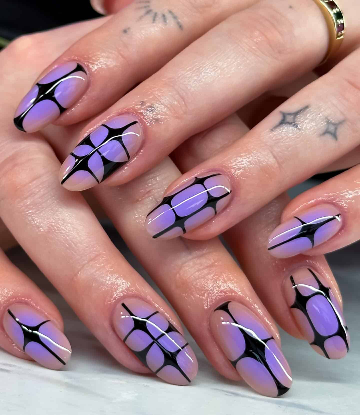 21. Lavender Almond Nails with Black Starburst Art - black and purple nail ideas