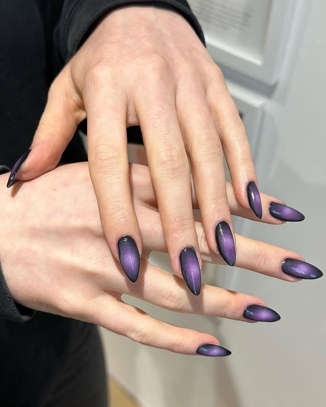 22. Black and Purple Cat-Eye Almond Nails - black and purple nail ideas