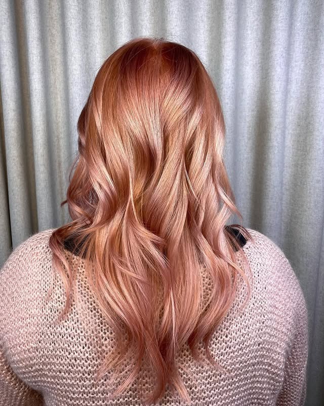 2. Peach Rose Gold Layered Waves - Rose Gold Hair Color