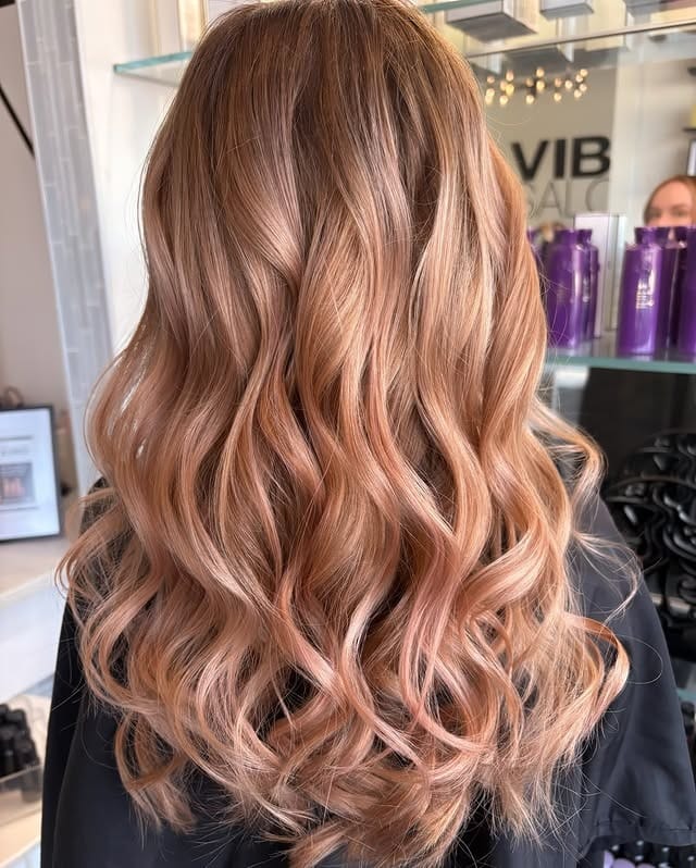12. Peach Rose Gold Long Curls - Rose Gold Hair Color
