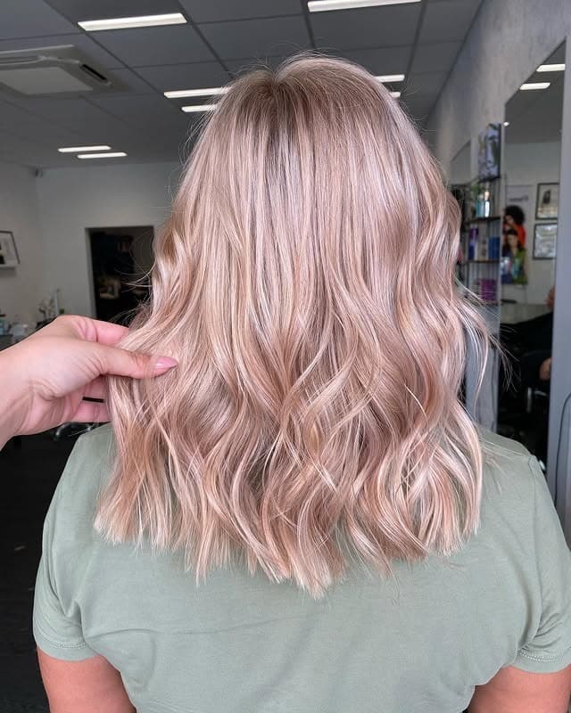 18. Pearl Rose Gold Shoulder-Length Waves - Rose Gold Hair Color
