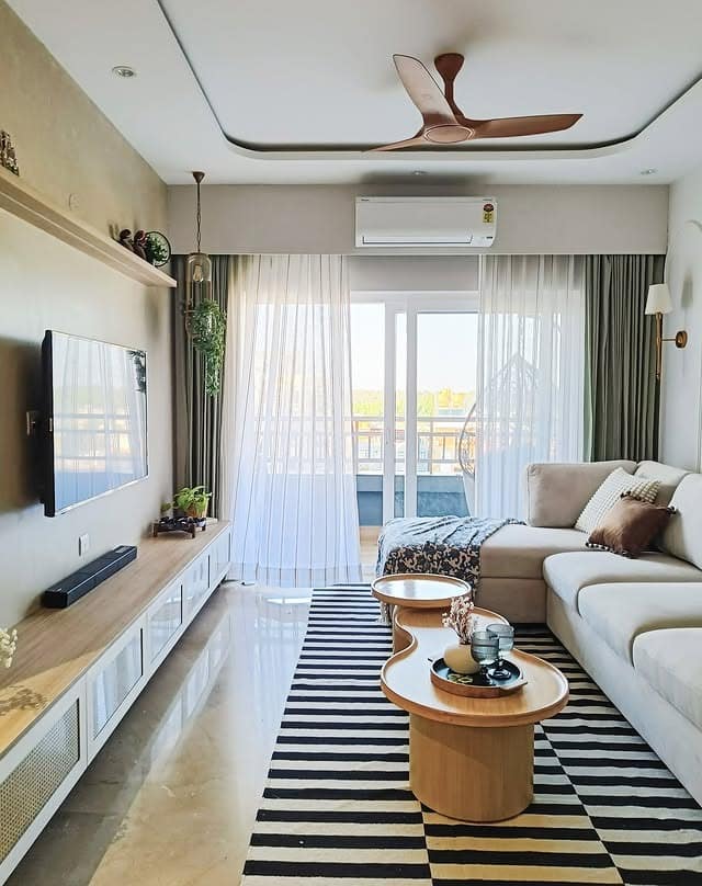 3. Cream, Black and Warm Wood Long Living Room Idea - long living room ideas