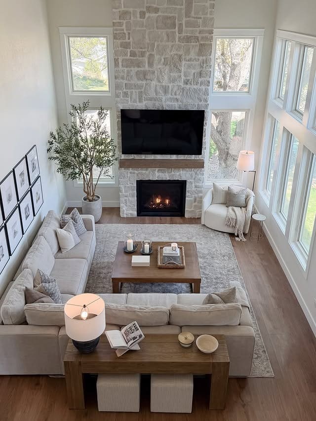 20. Soft Gray, White and Warm Walnut Double-Height Long Living Room Idea - long living room ideas