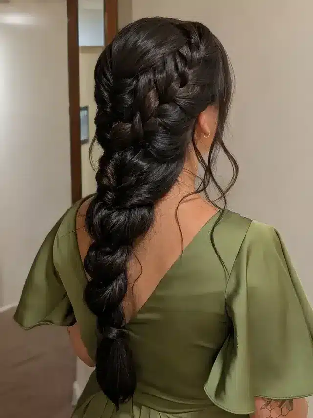19. Glossy Black Voluminous Side Braid - Long Hairstyles for Women
