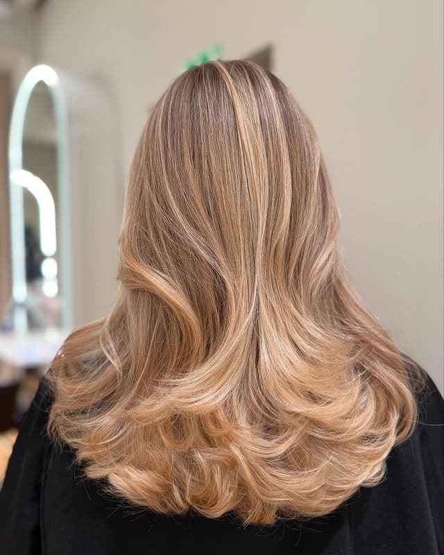 12. Soft Honey Blonde Feathered Layers with Golden Highlights - Honey Blonde Hair with Highlights