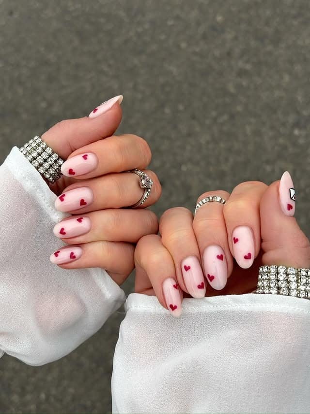 1. Blush Pink Almond Nails with Mini Red Hearts - february nail ideas