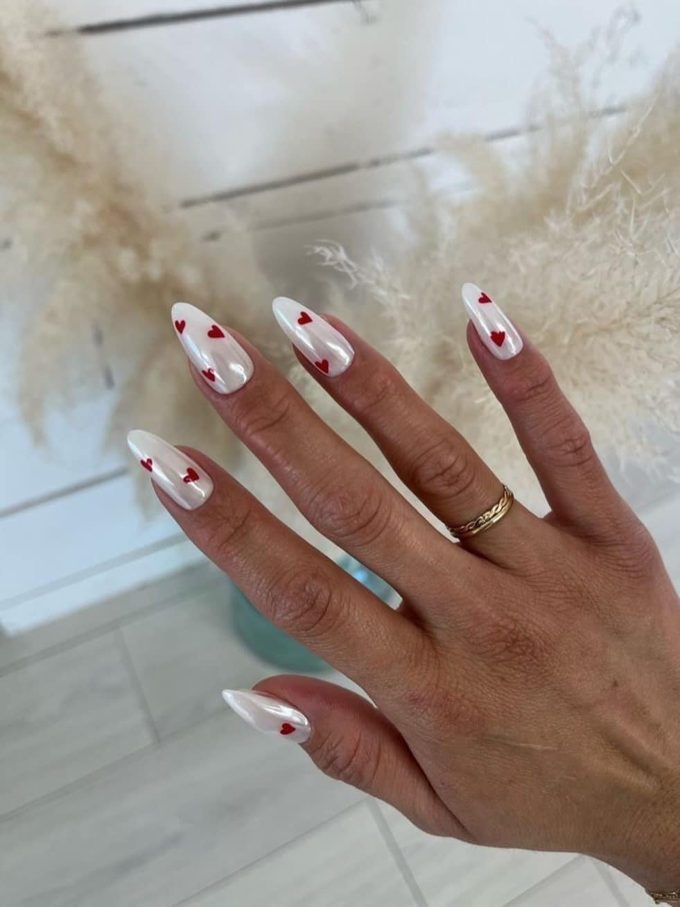 6. Pearl White Almond Nails with Red Hearts - february nail ideas