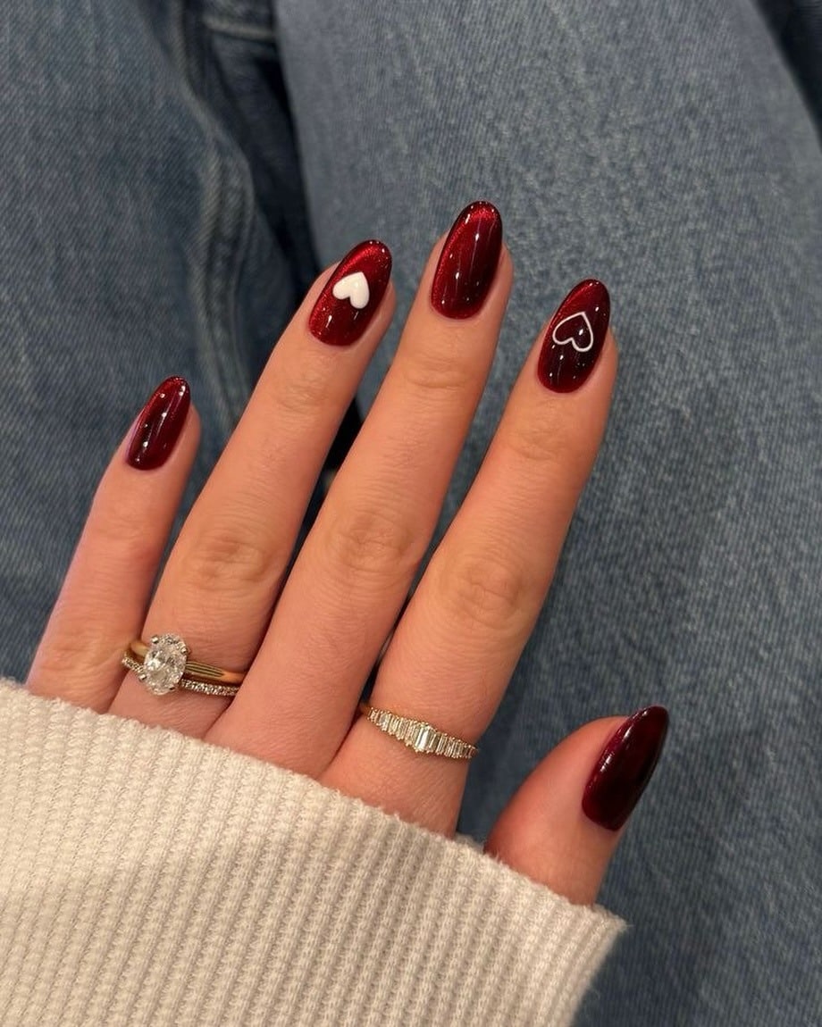 15. Burgundy Shimmer Almond Nails with White Hearts - february nail ideas