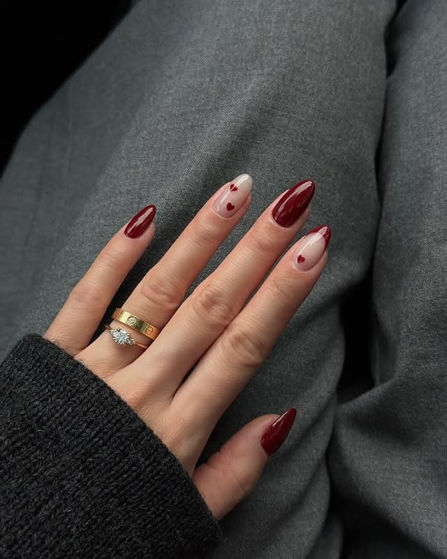 20. Burgundy Almond Nails with Sheer Heart Accents - february nail ideas