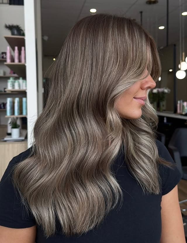 1. Smoky Dark Blonde Waves - Dark Blonde Hair Color