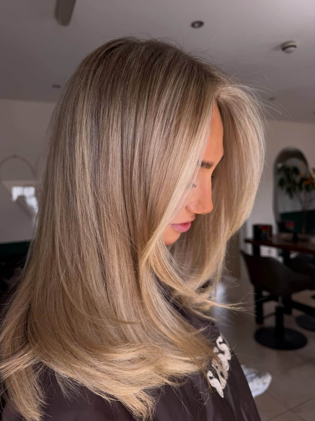 7. Champagne Dark Blonde Layered Blowout - Dark Blonde Hair Color