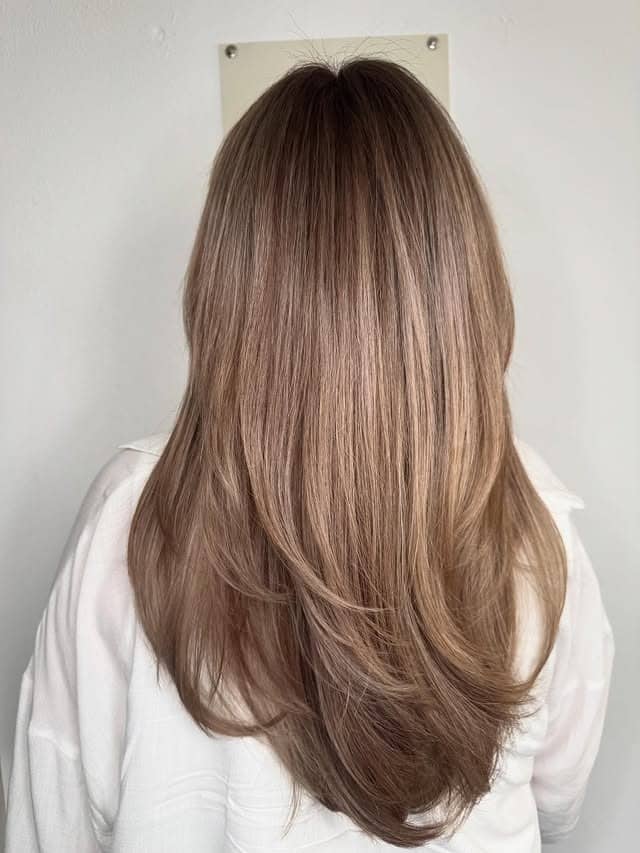 9. Neutral Dark Blonde Long Layers - Dark Blonde Hair Color