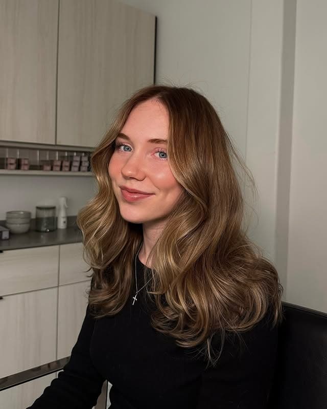 11. Caramel Dark Blonde Layered Waves - Dark Blonde Hair Color