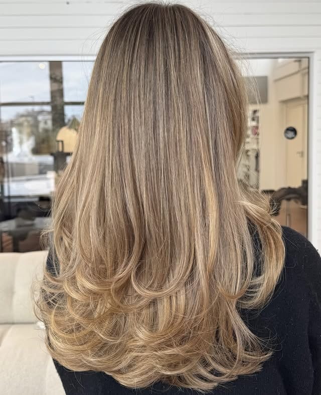 14. Sandy Dark Blonde Feathered Layers - Dark Blonde Hair Color